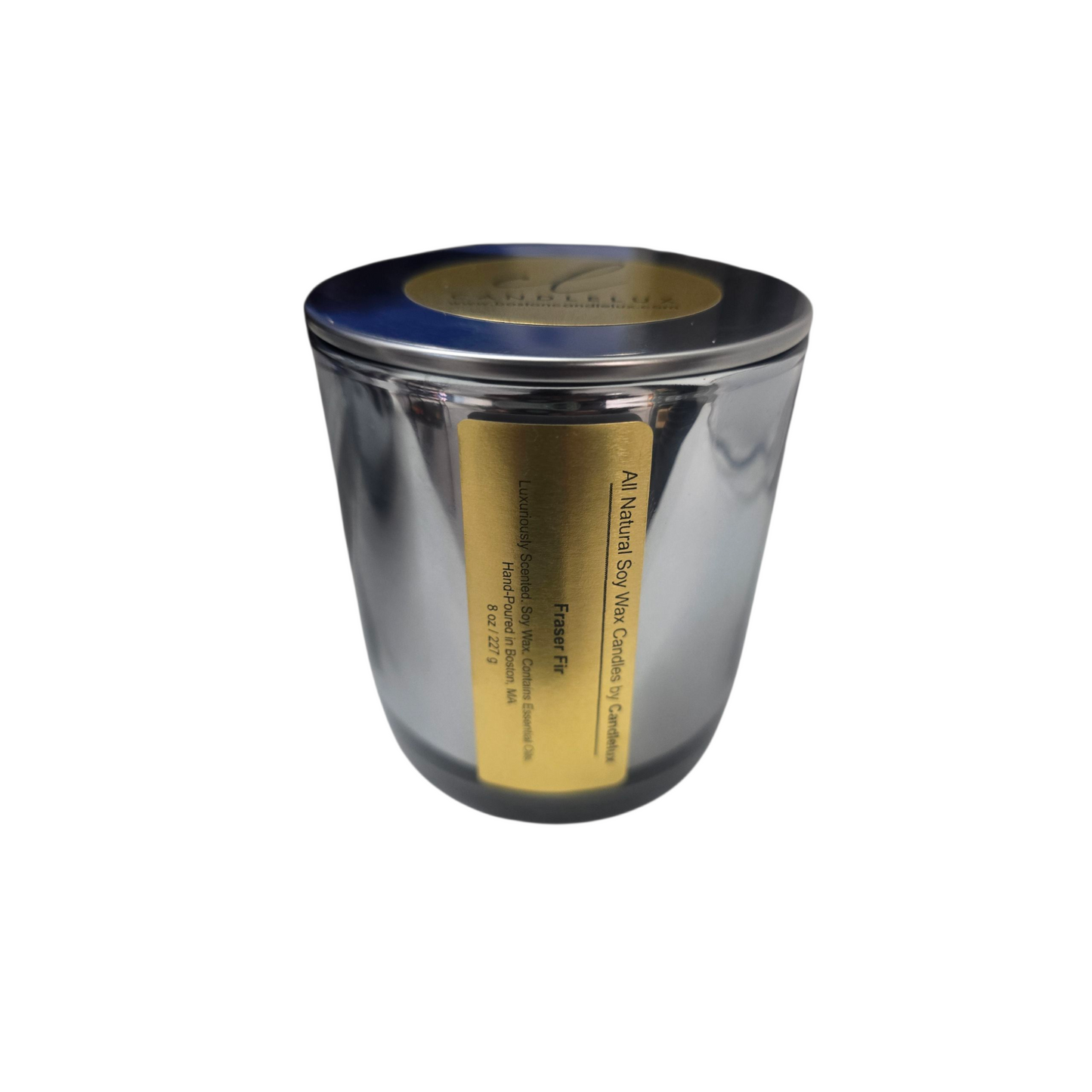 Fraser Fir candle in a mirrored silver vessel by CandleLux with a gold label, displayed on a white background. 8 oz clean soy wax winter scent.