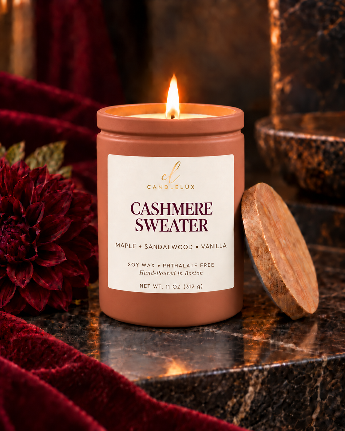 Cashmere Sweater CandleLux candle in orange 11-ounce glass vessel