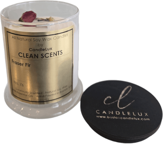 Picture of soy wax candle in a clear glass round vessel with a CandleLux Clean Scents Fraser Fir gold foil label on the front.