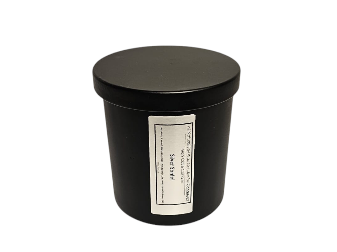 Man Cave Candle by CandleLux in a black matte 10oz vessel with a black lid and silver label.