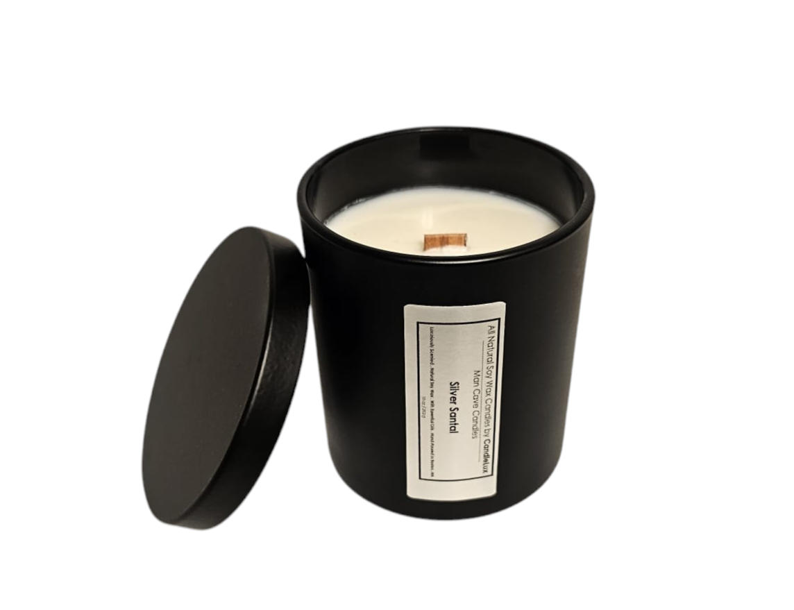 Man Cave Candle by CandleLux in a 10oz black vessel with black lid off showing the candle with a wooden wick.