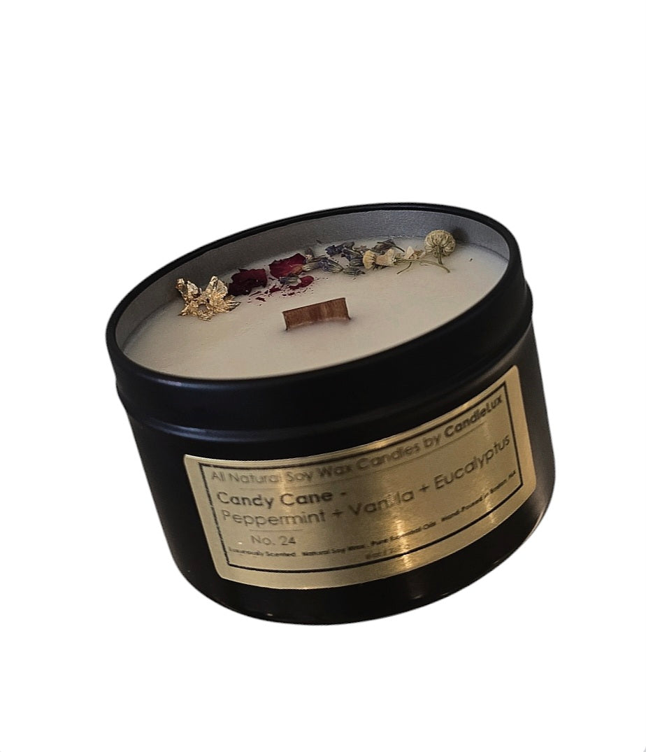 Picture of soy wax candle in a black travel tin with a CandleLux Spa Collection Candly Cane gold foil label on the front.