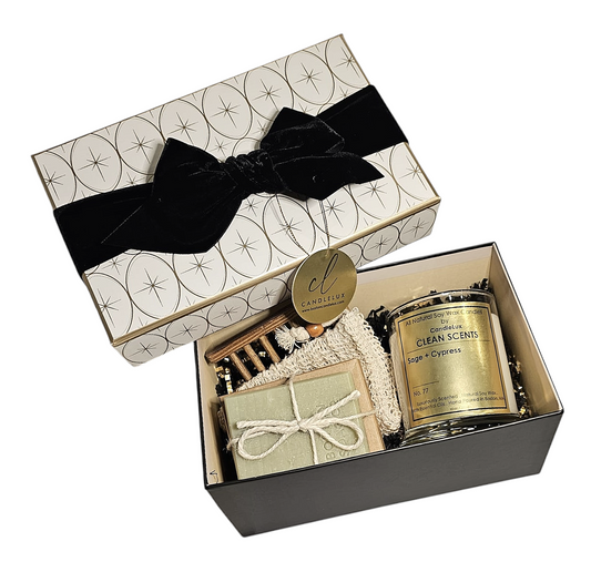 Boxed gift set with a boxed soap by Boston Soap Co a soap loofah saver and wooden soap saver along with a 10oz glass vessel soy wax candle by CandleLux.